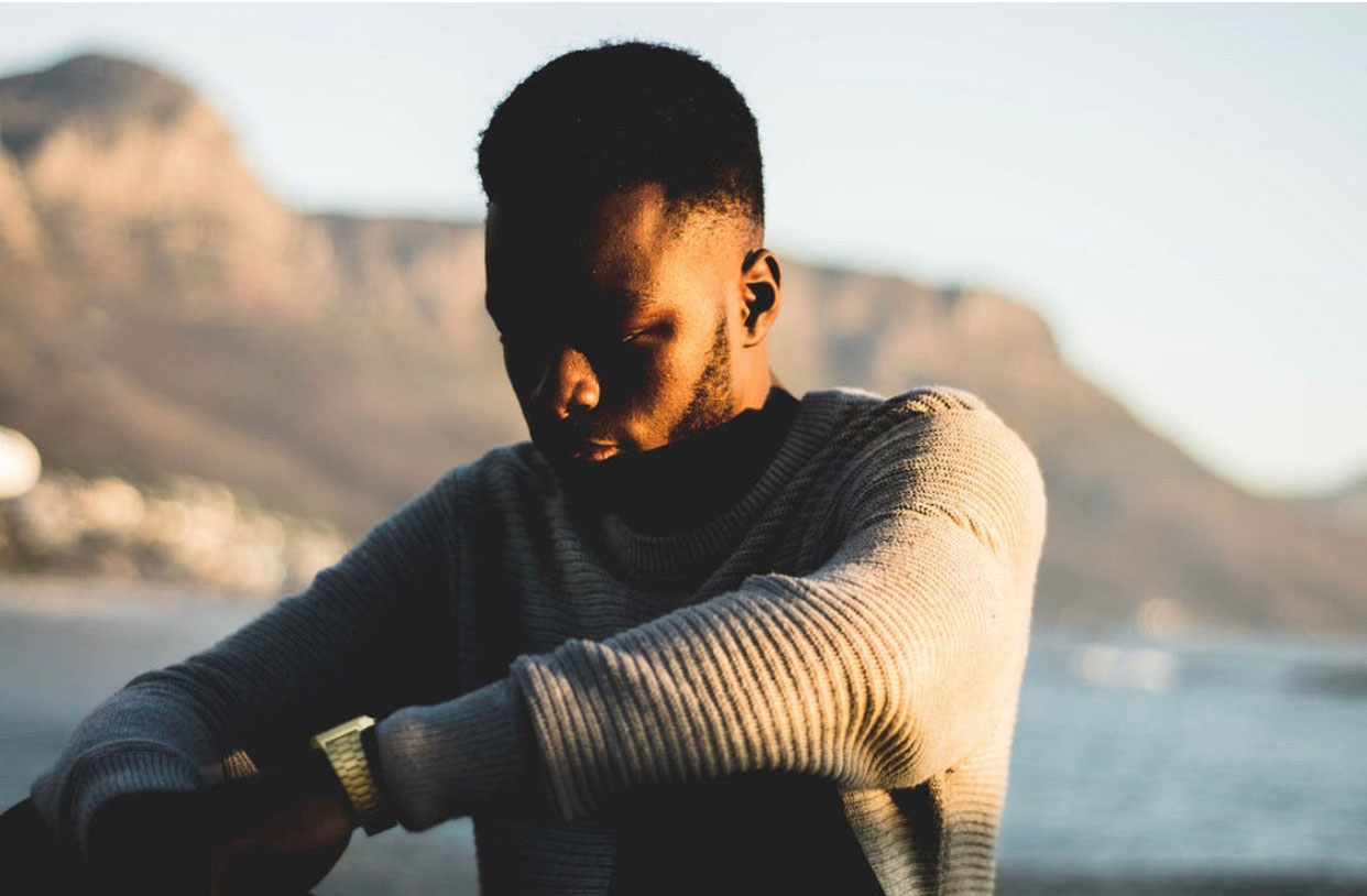 Man looking sort of depressed as he looks down